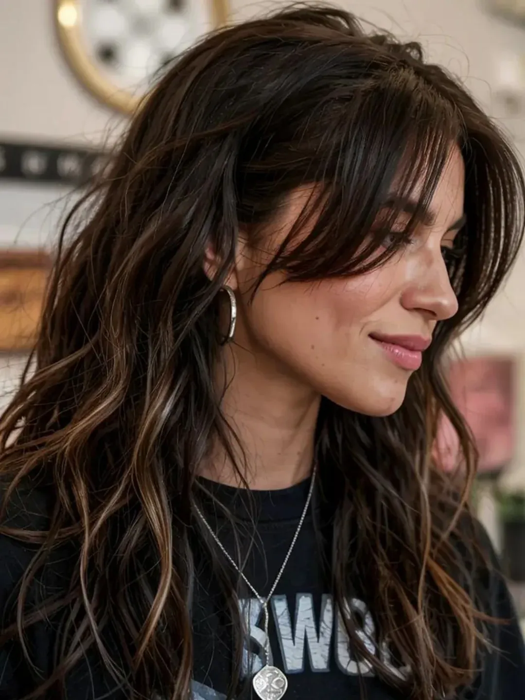 Long dark wavy shag with wispy fringe and textured layers
