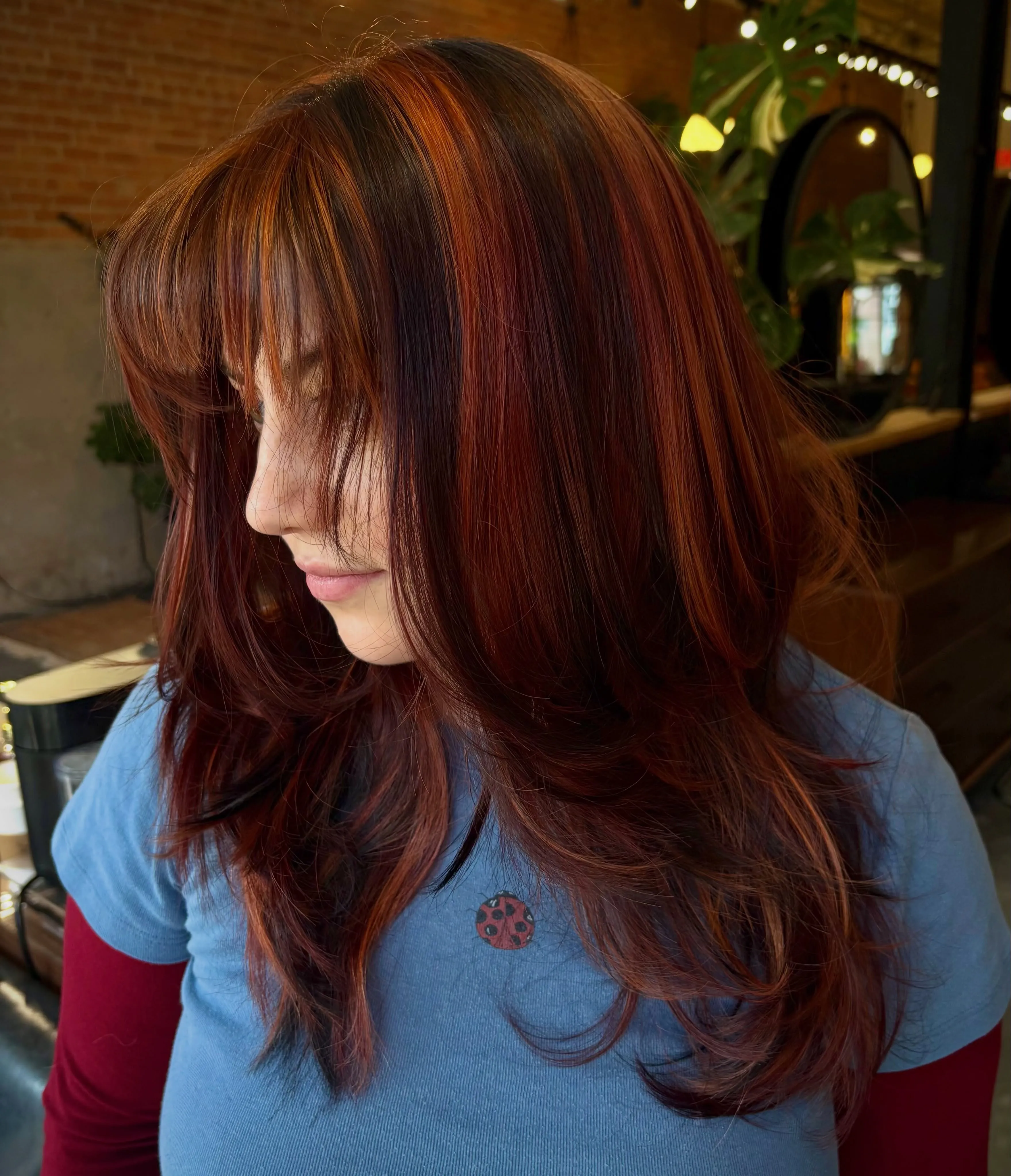 Deep red long layers with full fringe and curved ends
