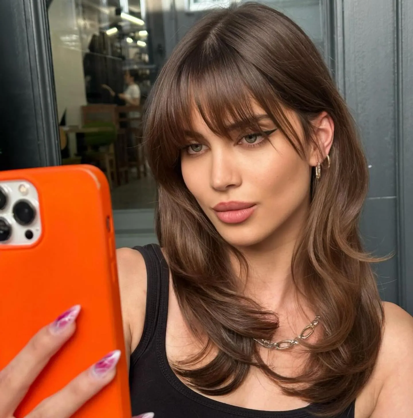 Layered shoulder-length lob with wispy bangs