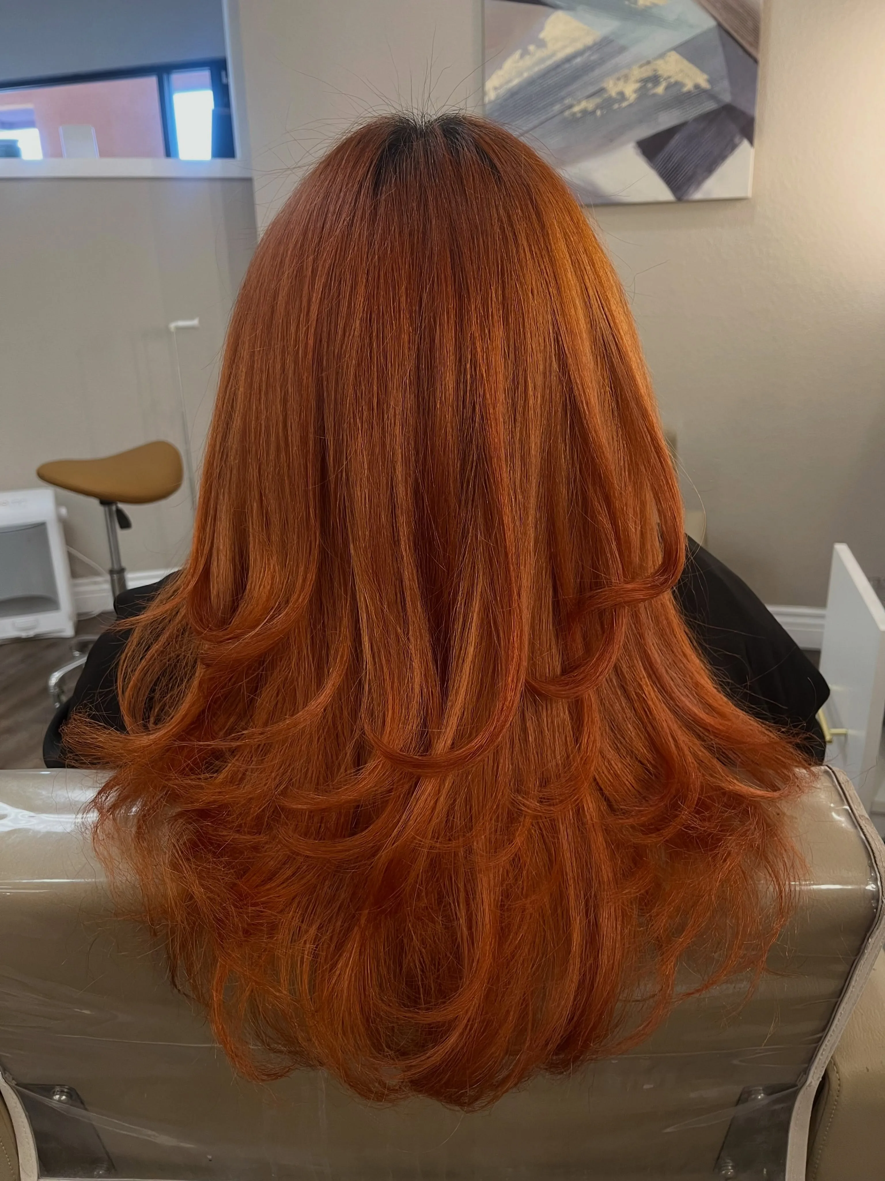 Long copper haircut with visible rounded back layers
