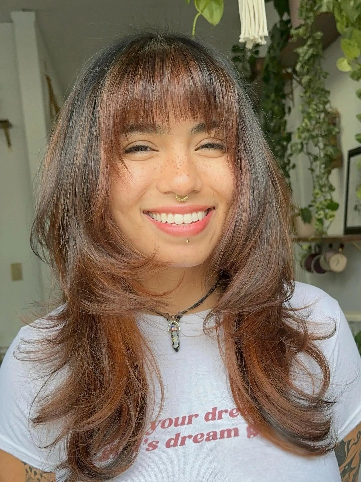 Rounded medium layers with wispy bangs and flipped ends
