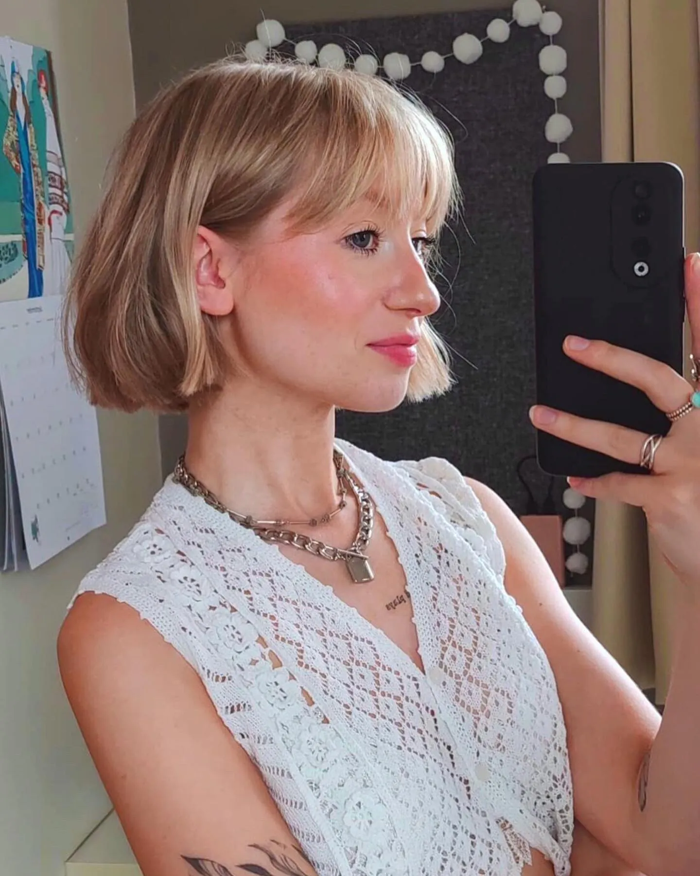Blonde bob with soft full fringe and slightly flipped ends
