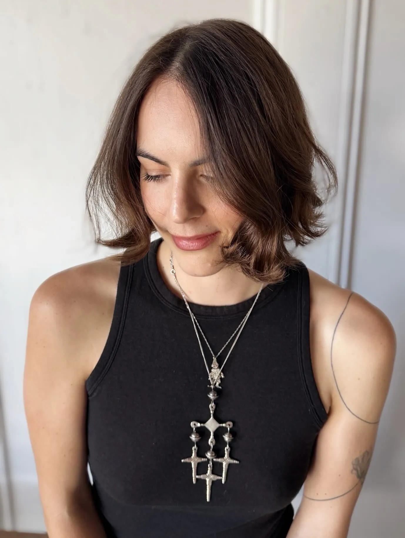 Brunette center-part bob with curved outward ends