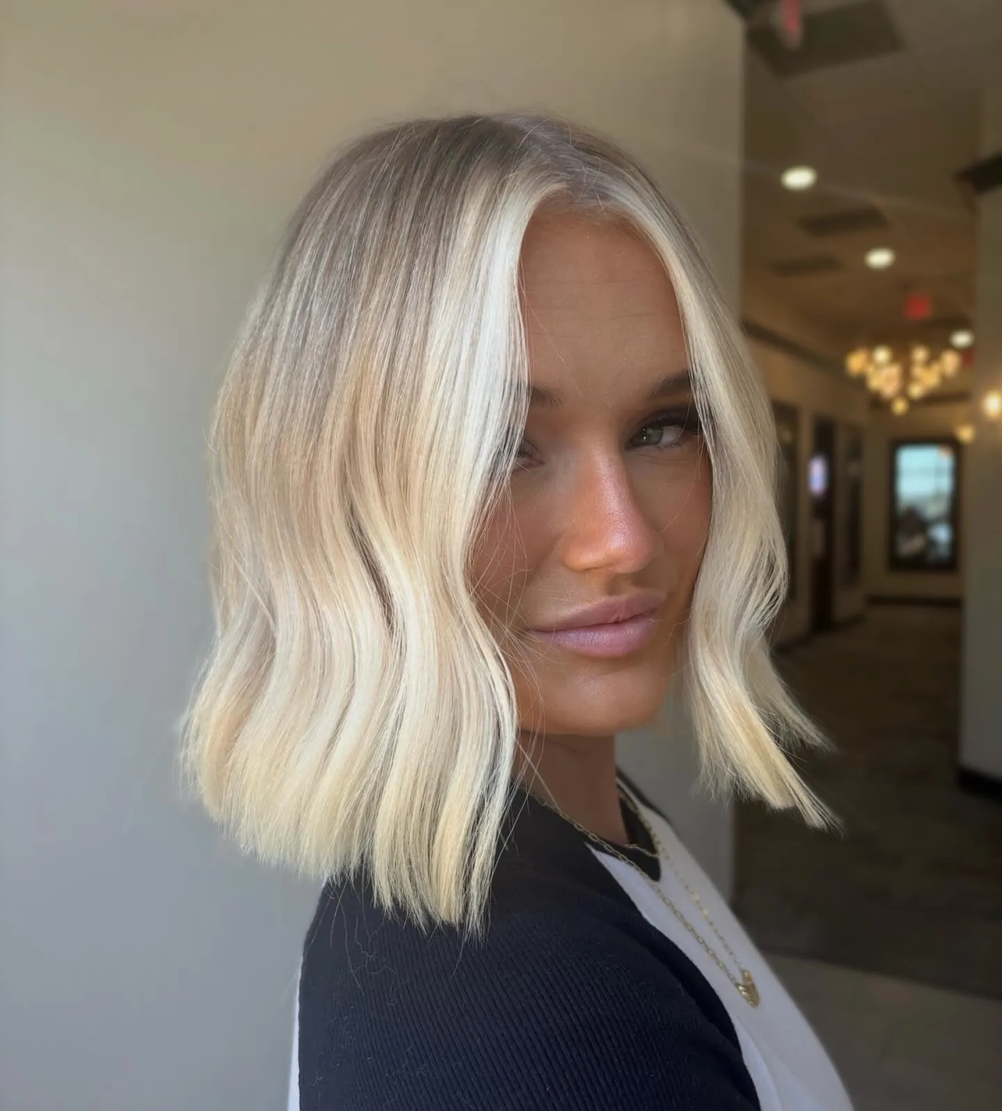 Platinum blonde wavy bob with soft outward ends