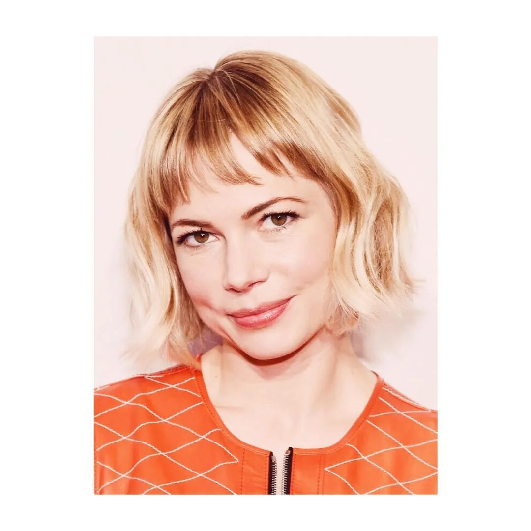 Blonde bob with wispy fringe and softly flipped texture