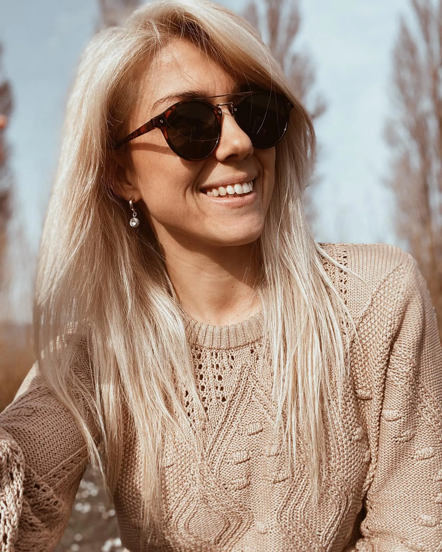 Long blonde hair with deep side sweep and soft layers