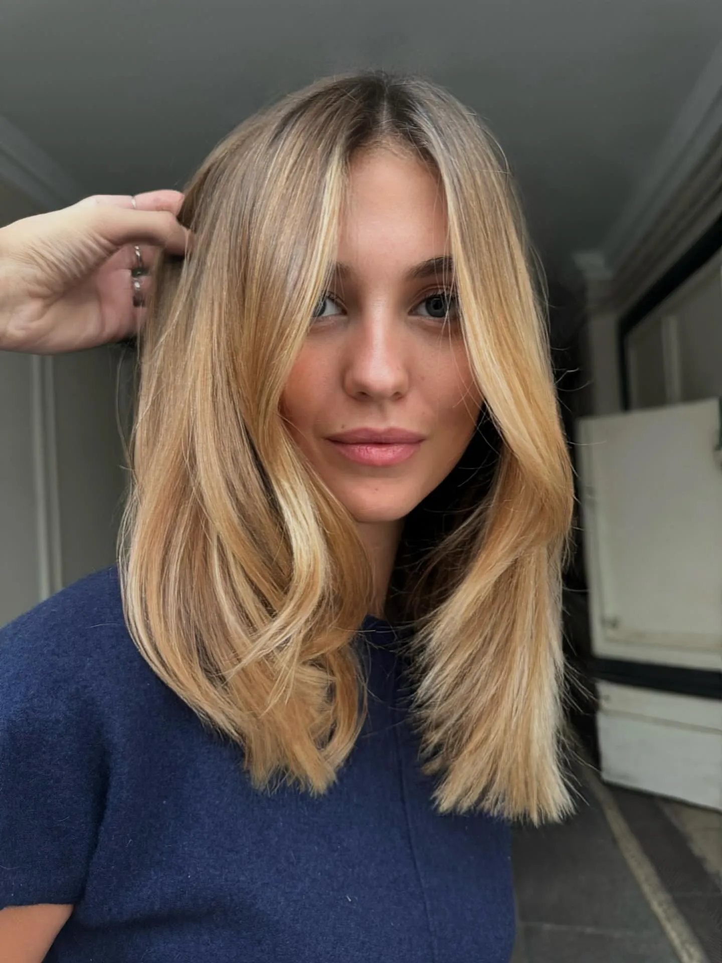 Shoulder-length blonde hair with soft face-framing layers