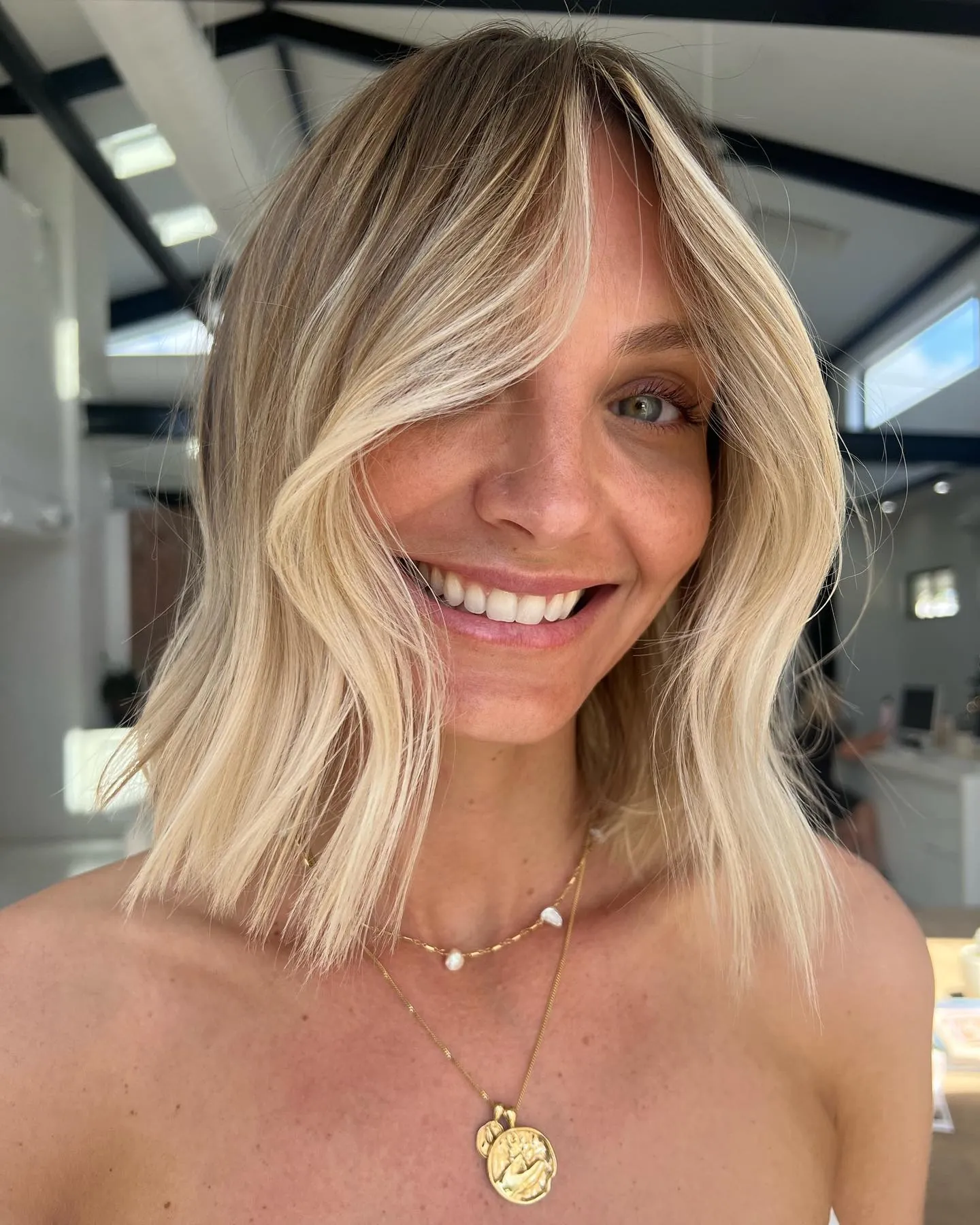 Blonde lob with curtain fringe and loose waves
