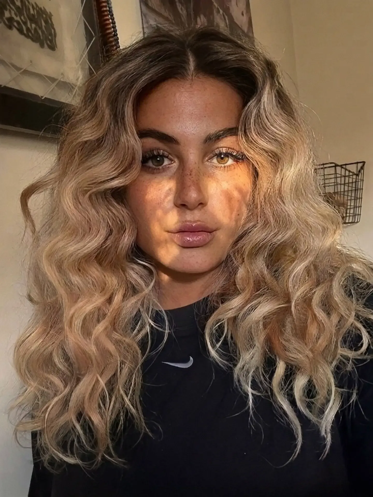 Long blonde hair with loose defined curls