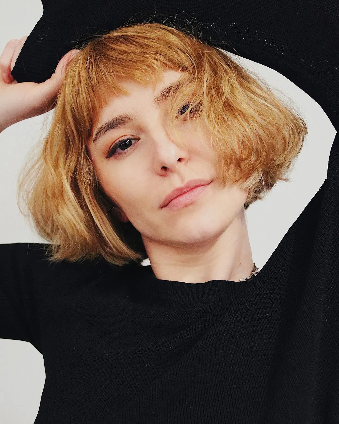 Tousled blonde French bob with short textured fringe