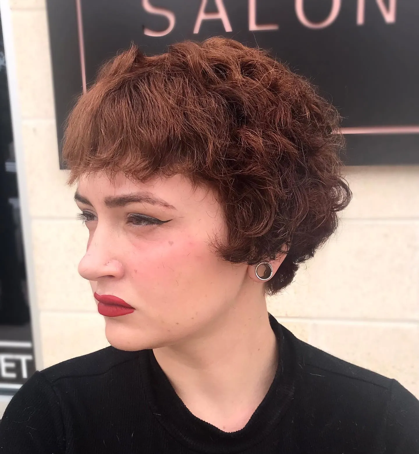 Curly pixie with very short baby bangs