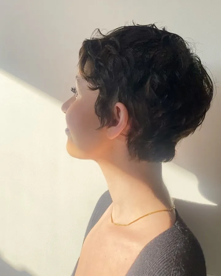 Curly tapered pixie with short nape and fuller top