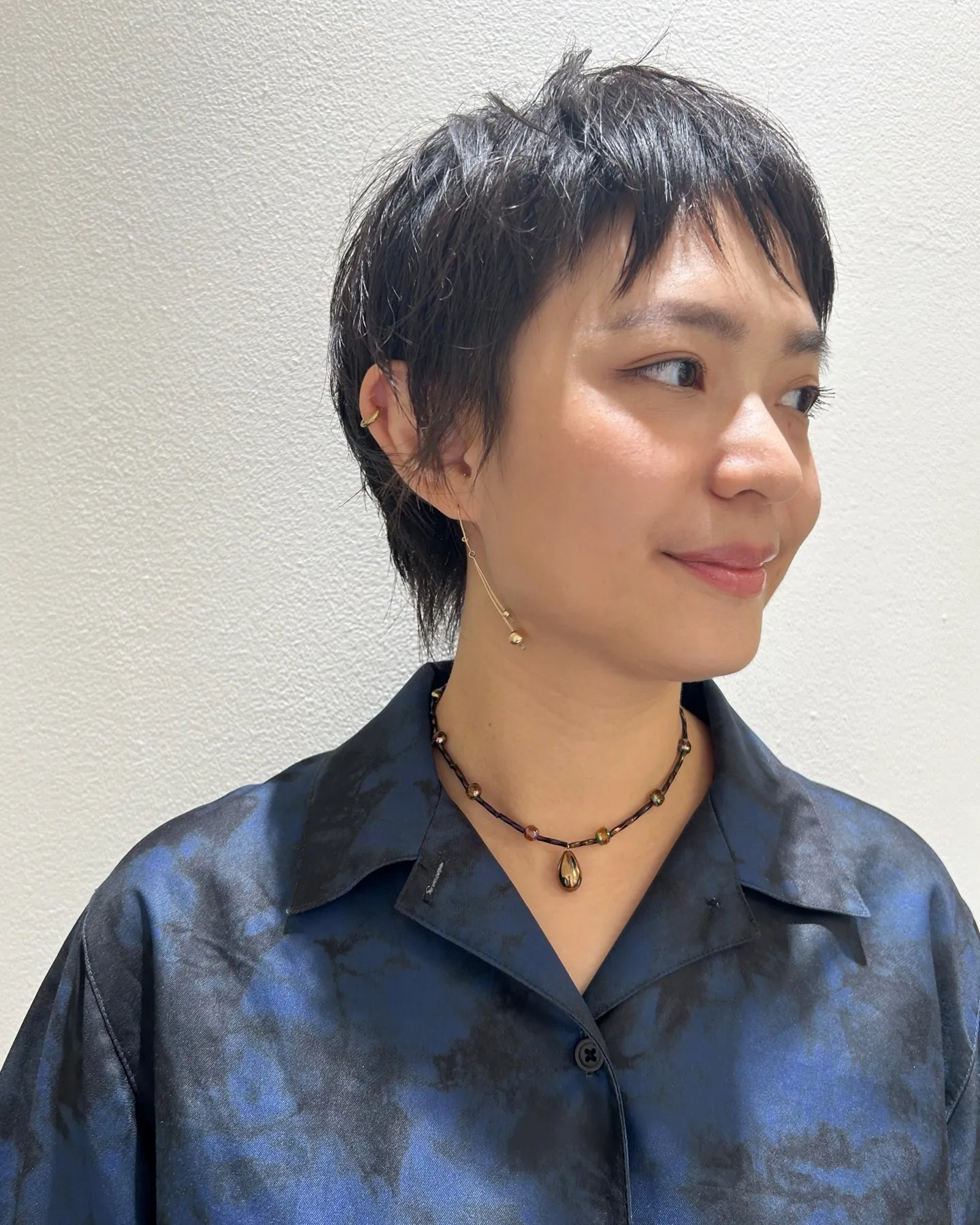 Short dark pixie with piecey cropped fringe