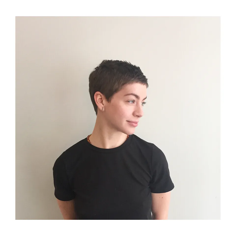Very short dark pixie with clean cropped shape