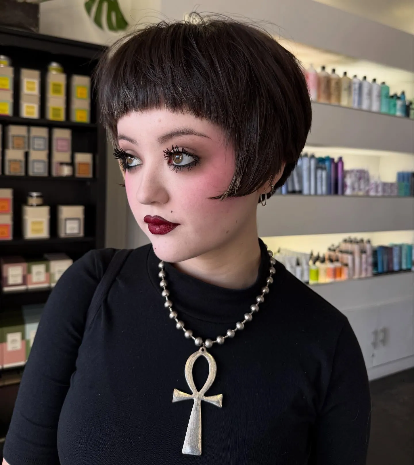 Rounded dark pixie bob with micro bangs