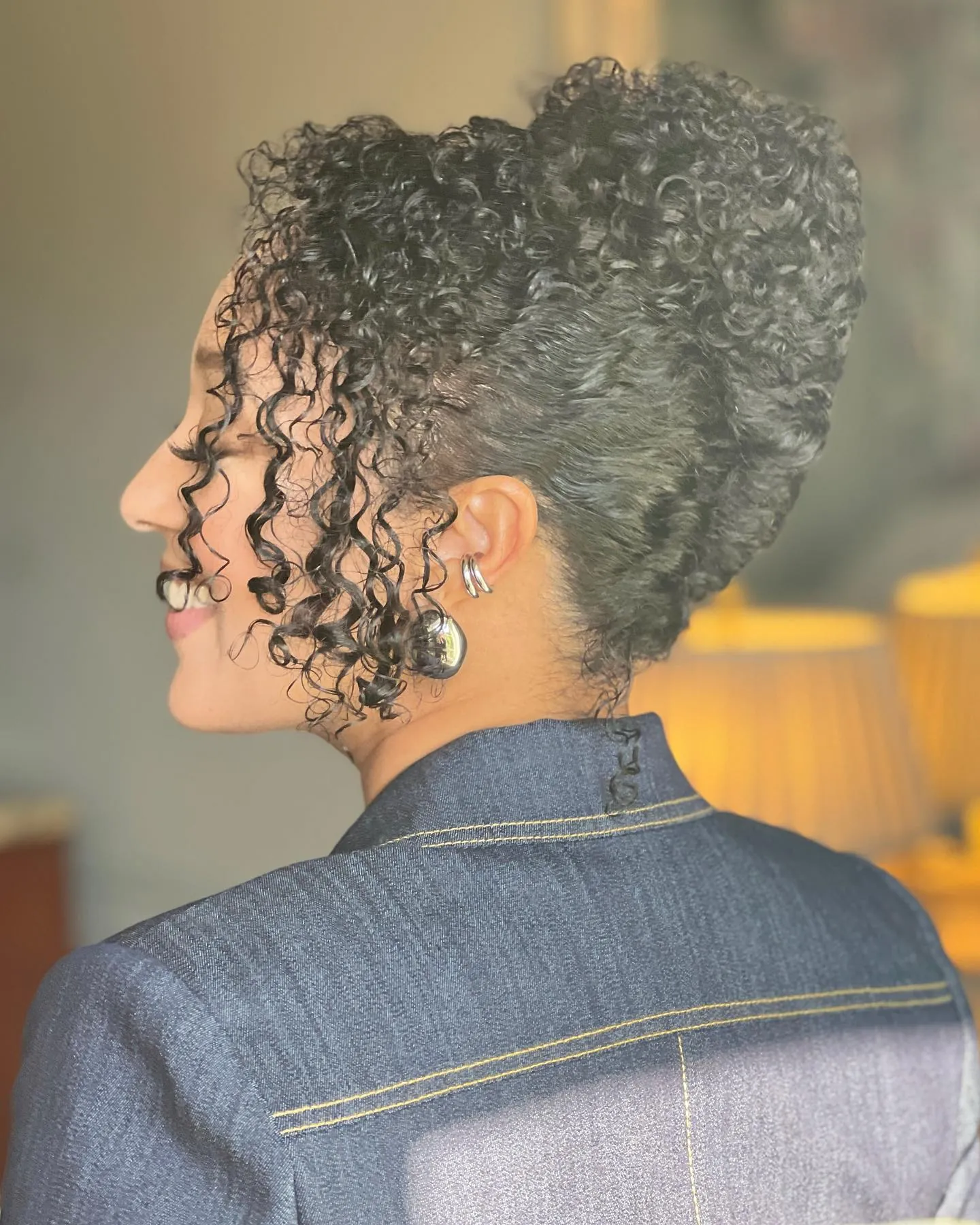 High curly French twist with loose tendrils