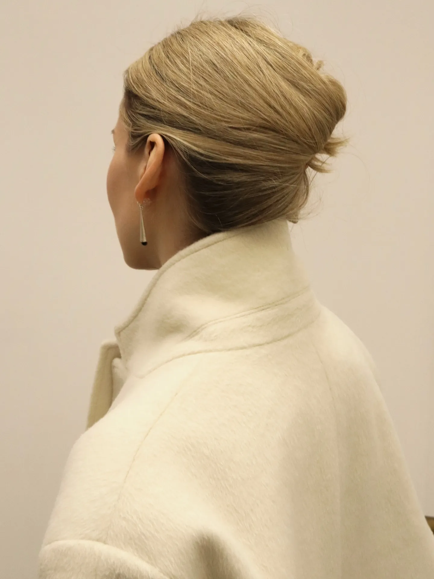 Minimal low blonde French twist with smooth finish