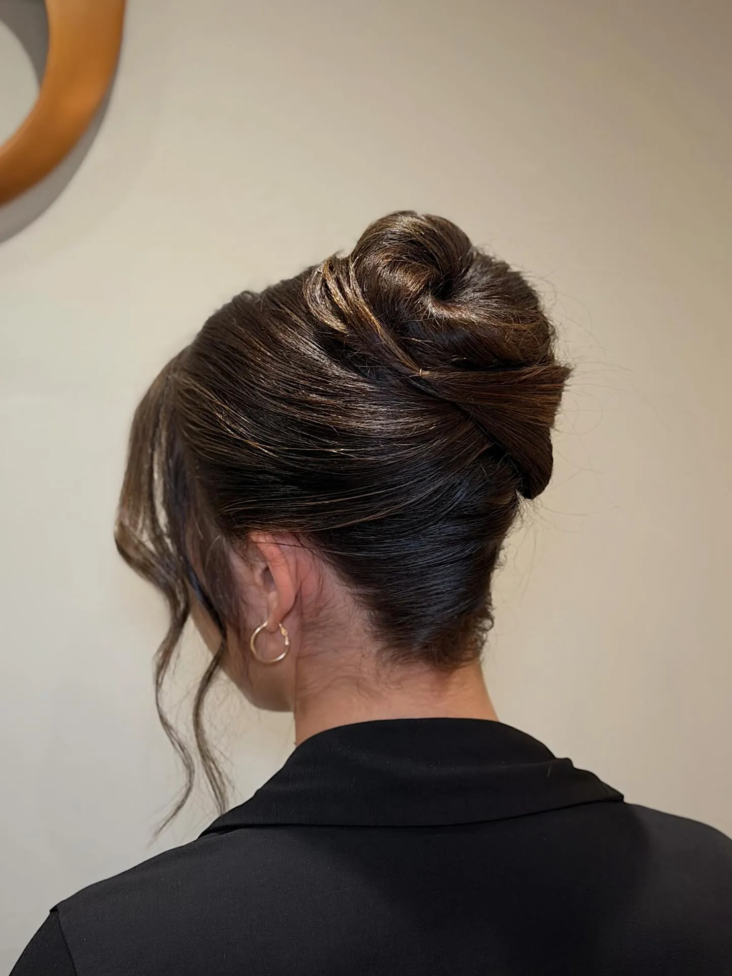 Textured dark French twist with lifted crown