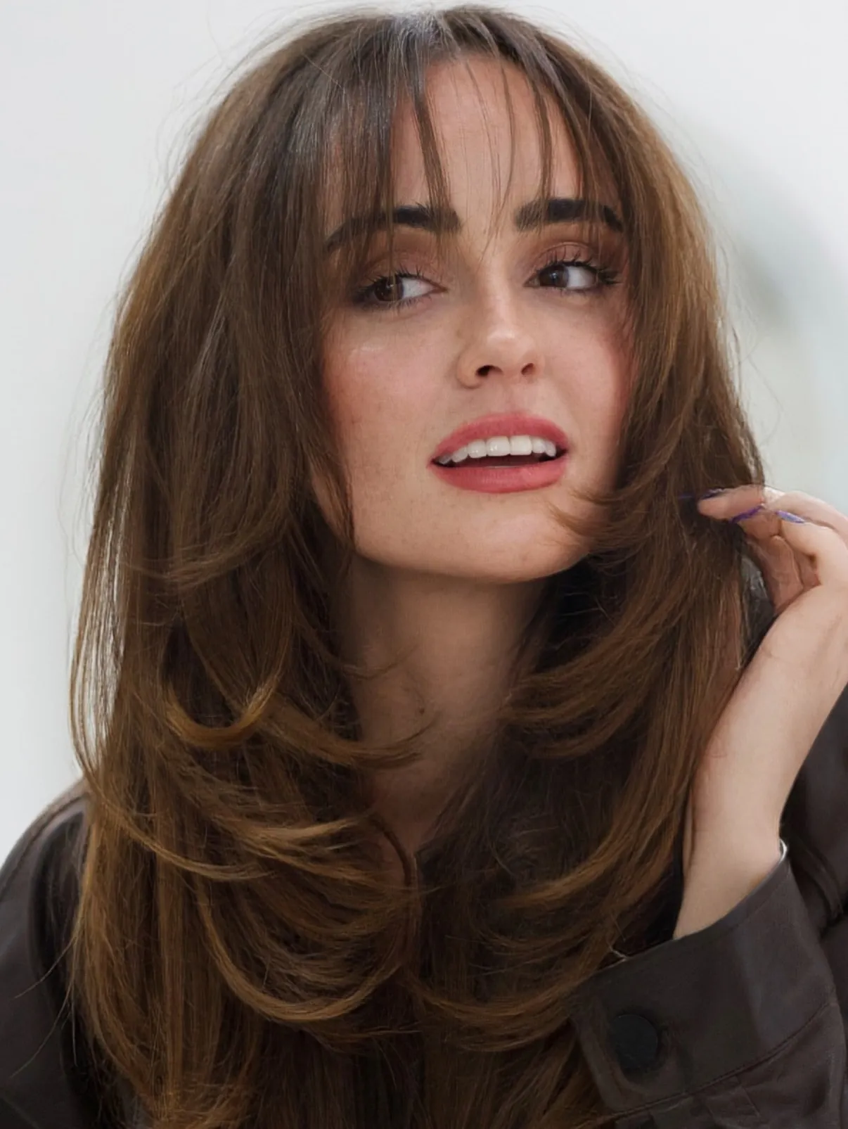 Layered Curtain Bangs with light French-inspired fringe