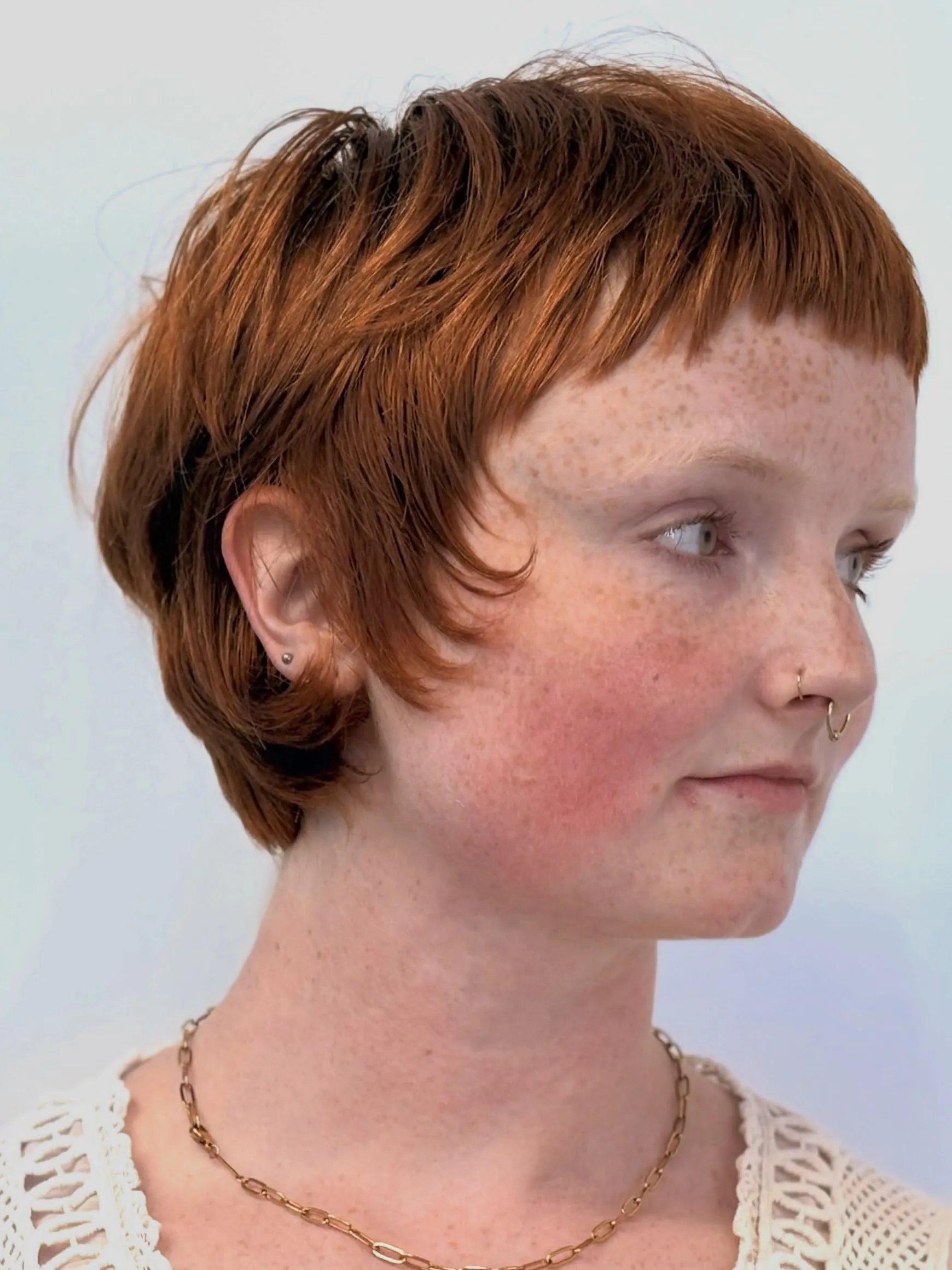 Copper rounded pixie with short fringe and curled side pieces