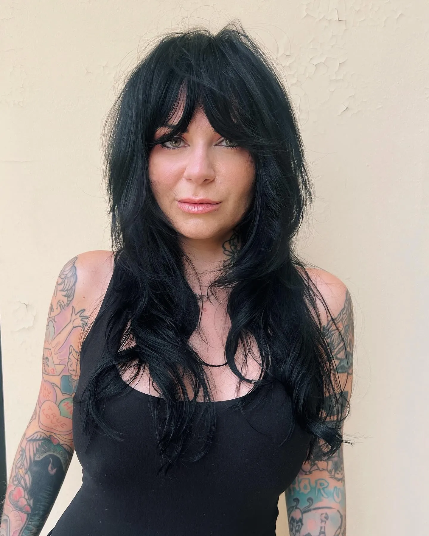 Long black wavy shag with curtain bangs