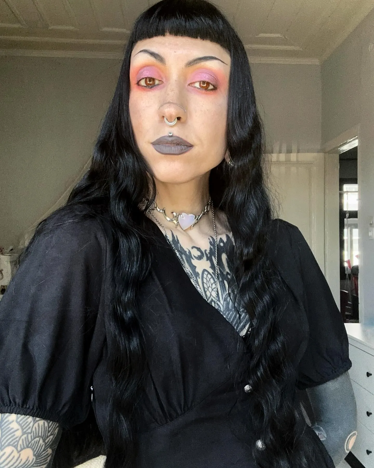Long black waves with curved micro bangs