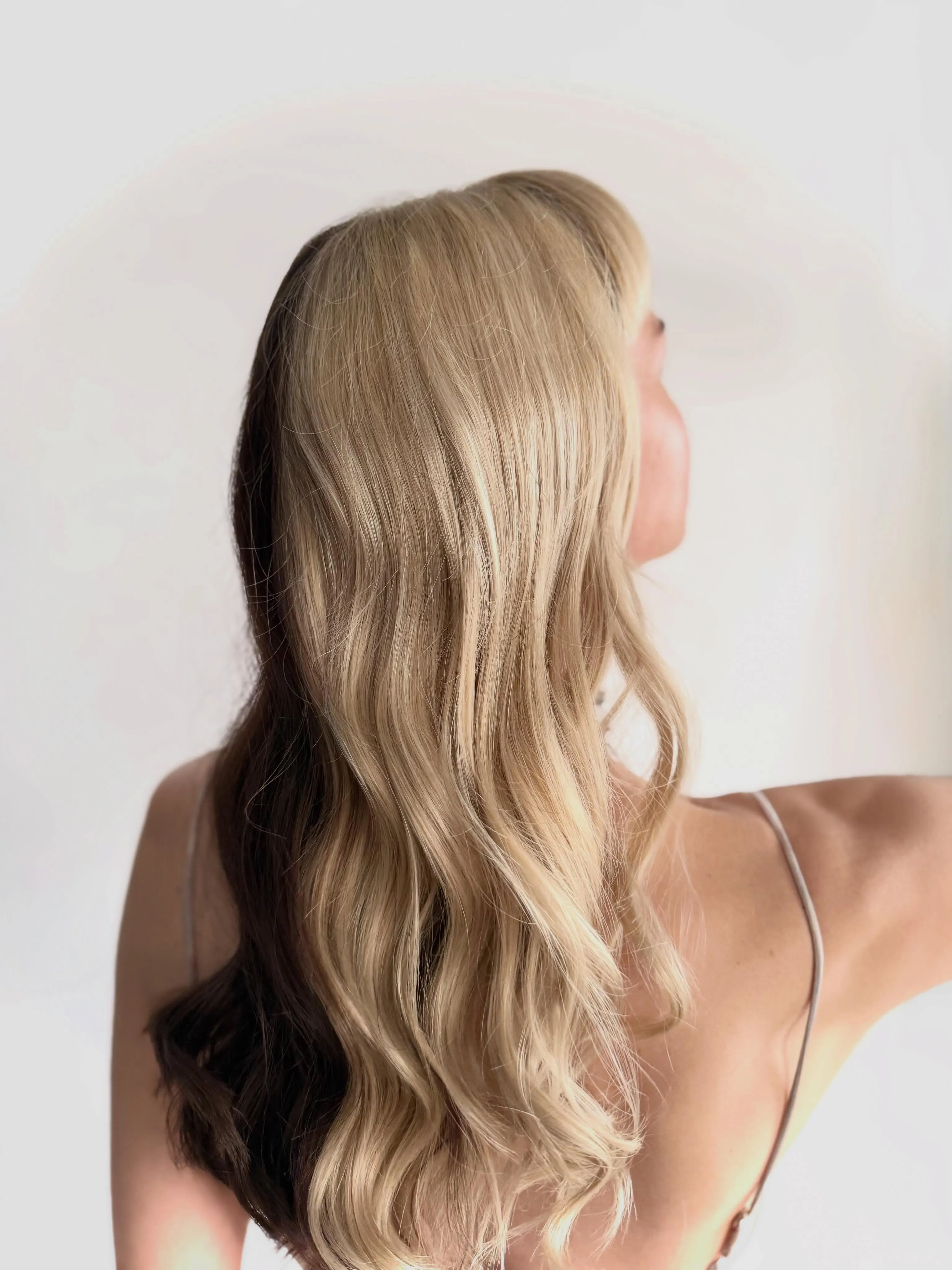 Long light hair with soft brushed waves through the ends