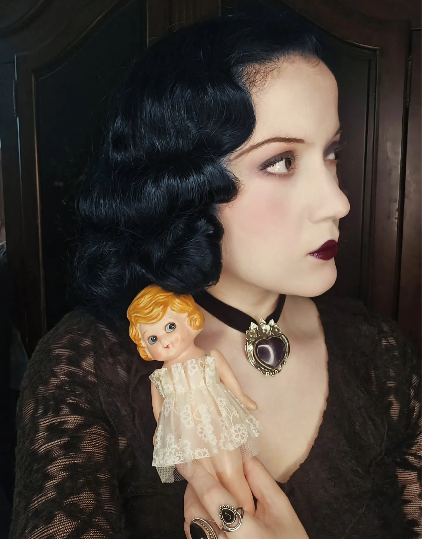 Short black hair with deep side-parted finger waves