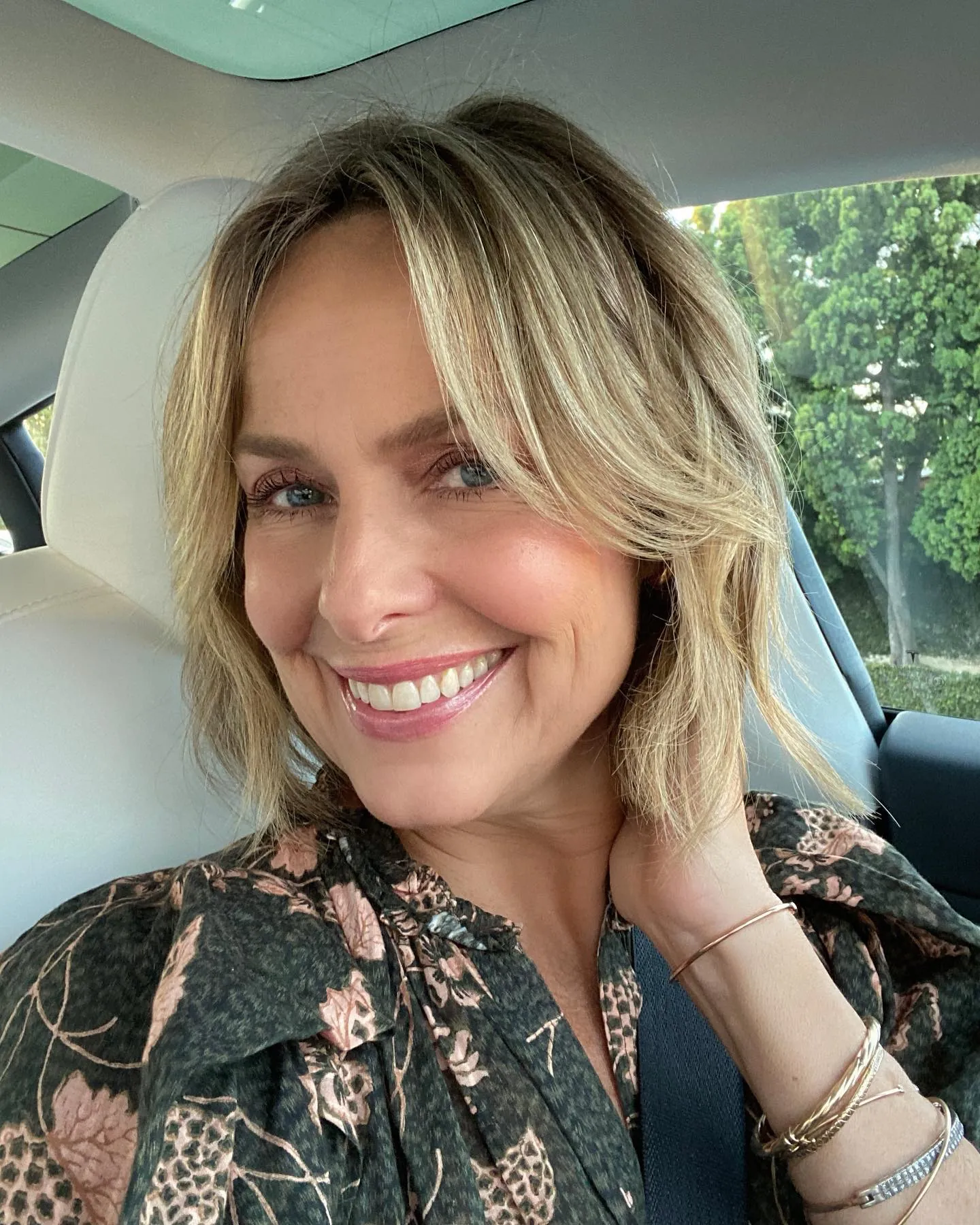 Soft blonde halo haircut with curtain fringe