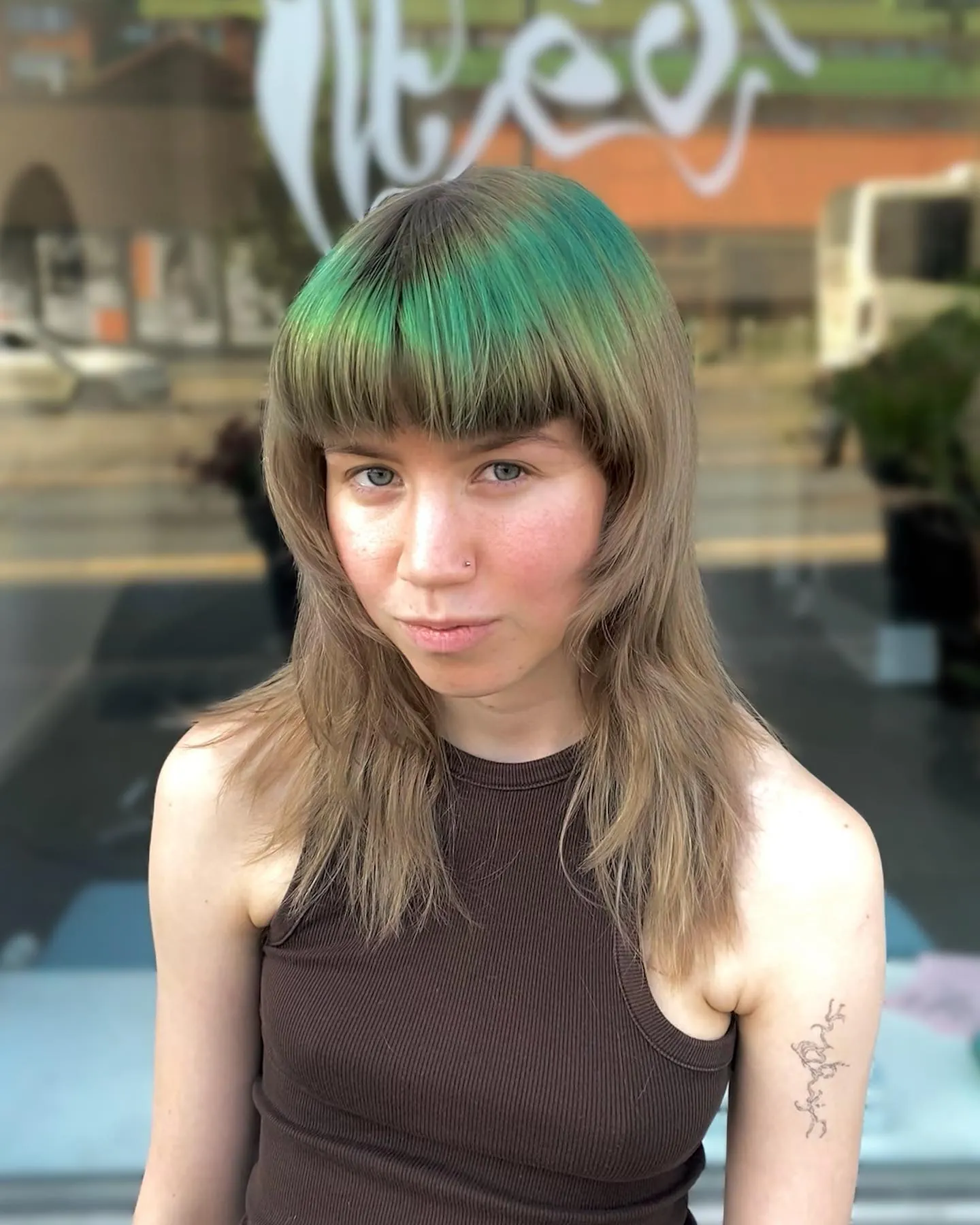 Long halo haircut with full fringe and tapered layers