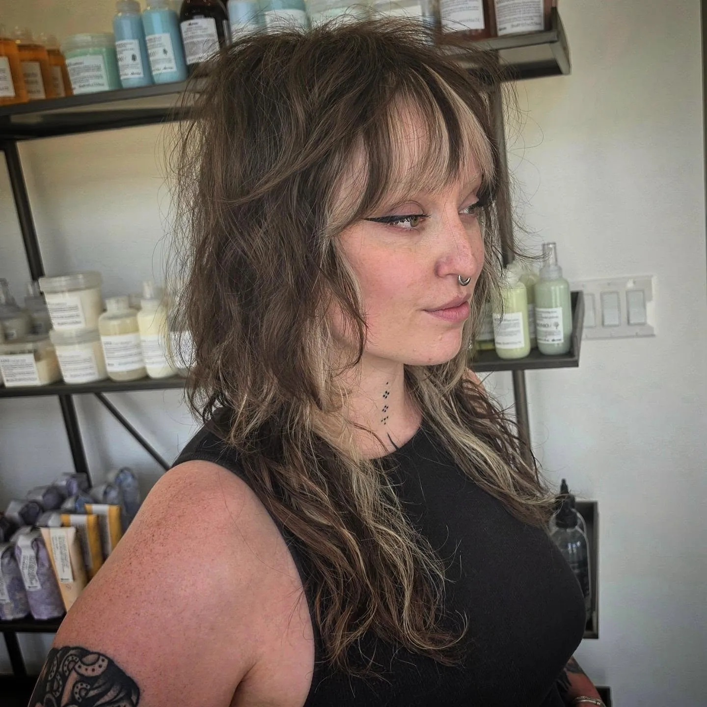 Shaggy medium halo haircut with wispy fringe