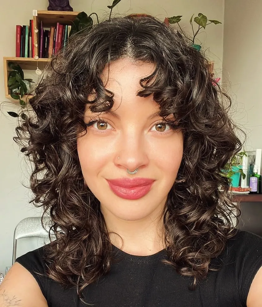 Curly shoulder cut with curtain fringe and rounded layers