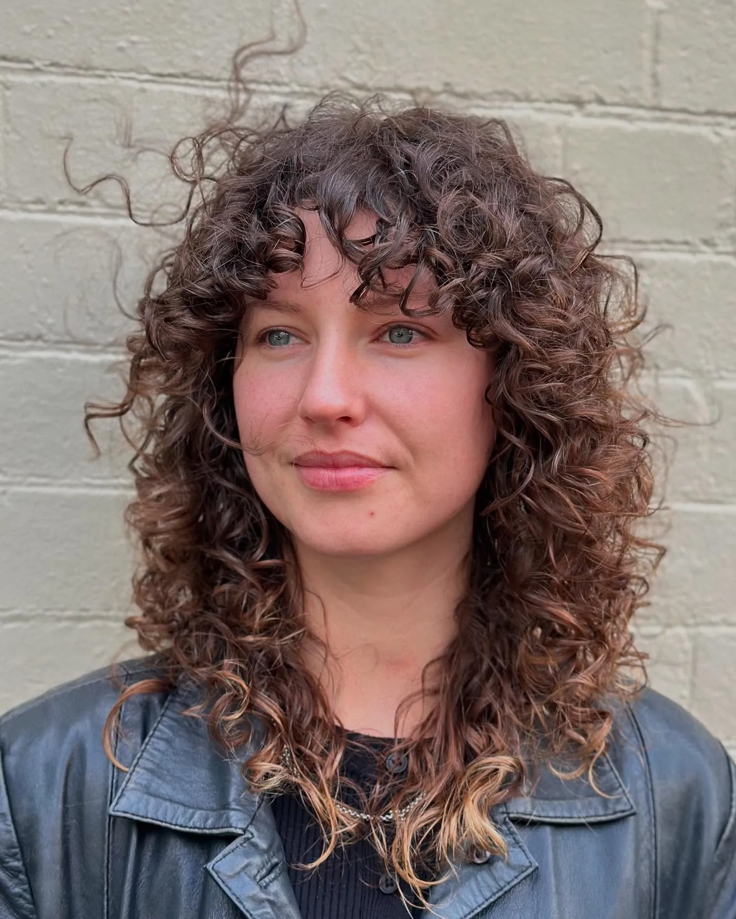 Highlighted curly layers with fringe and lighter ends