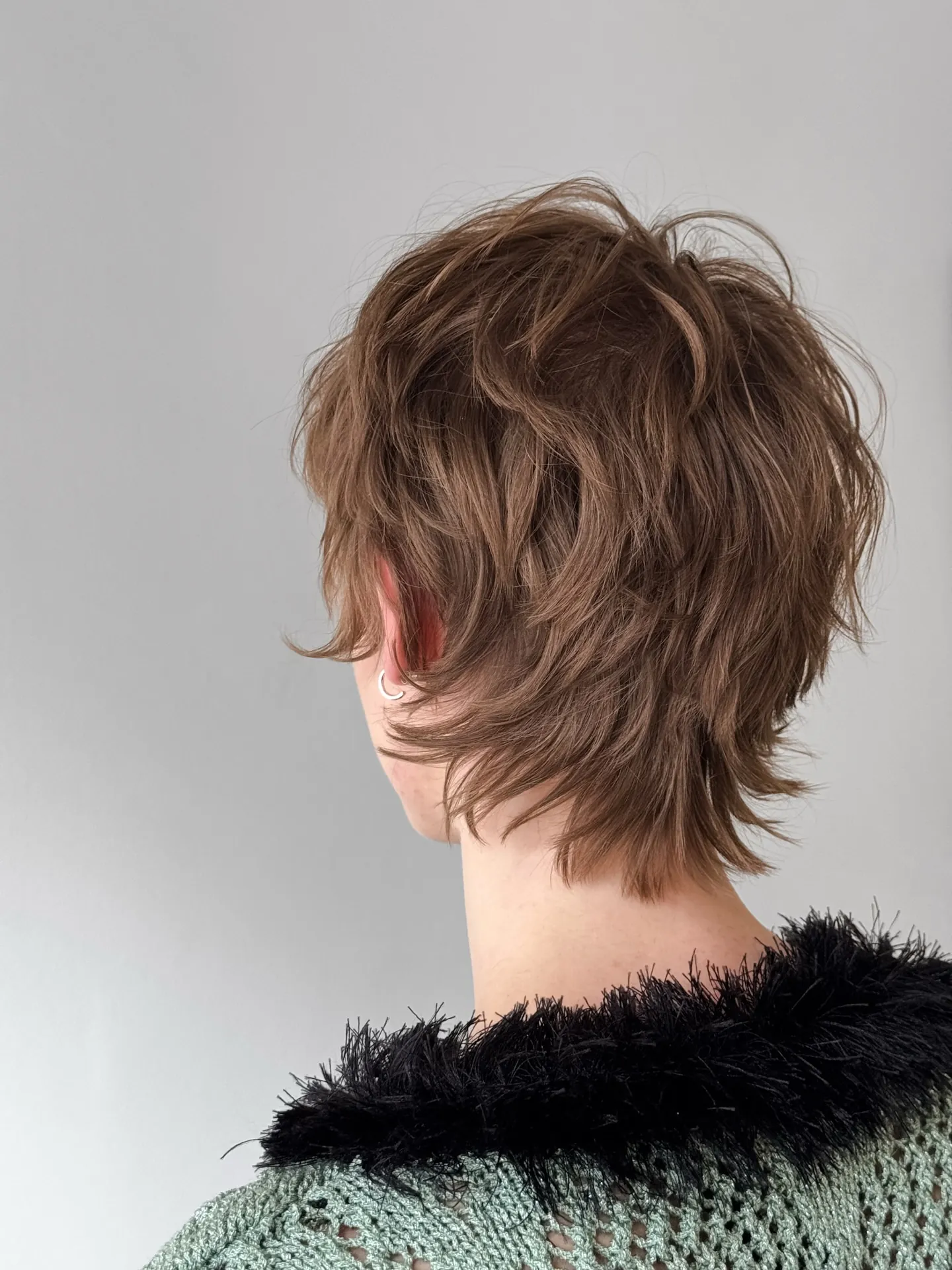 Feathered shaggy pixie with layered nape
