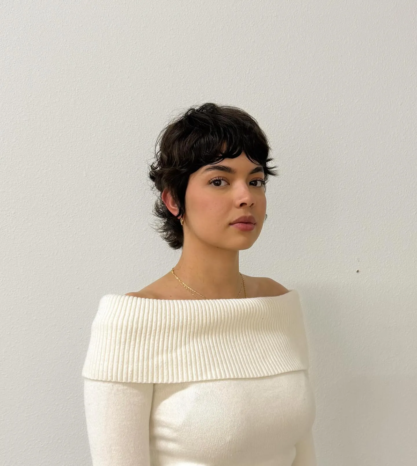 Tapered curly pixie with short layered fringe