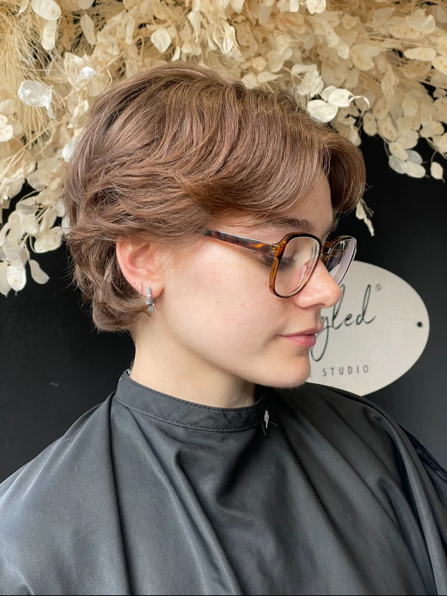 Side-swept layered bixie with tucked back