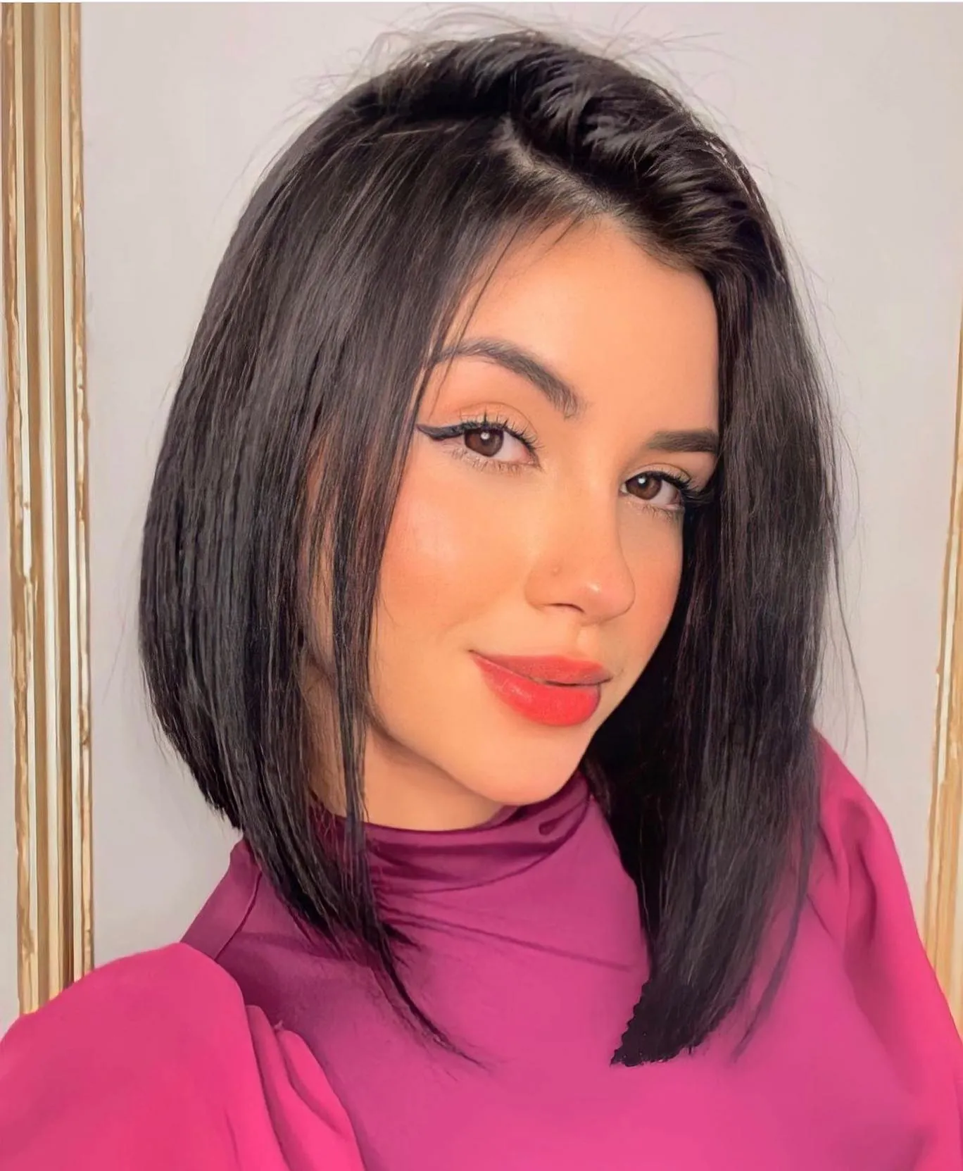 Dark side-part long bob with sleek angled front pieces