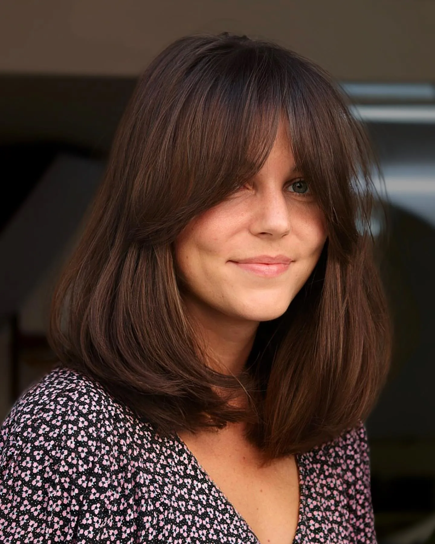 Rounded brown long bob with long curtain bangs and curved ends