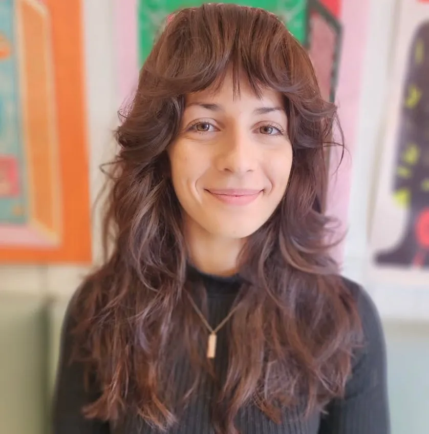 Long auburn shaggy layers with a wispy full fringe