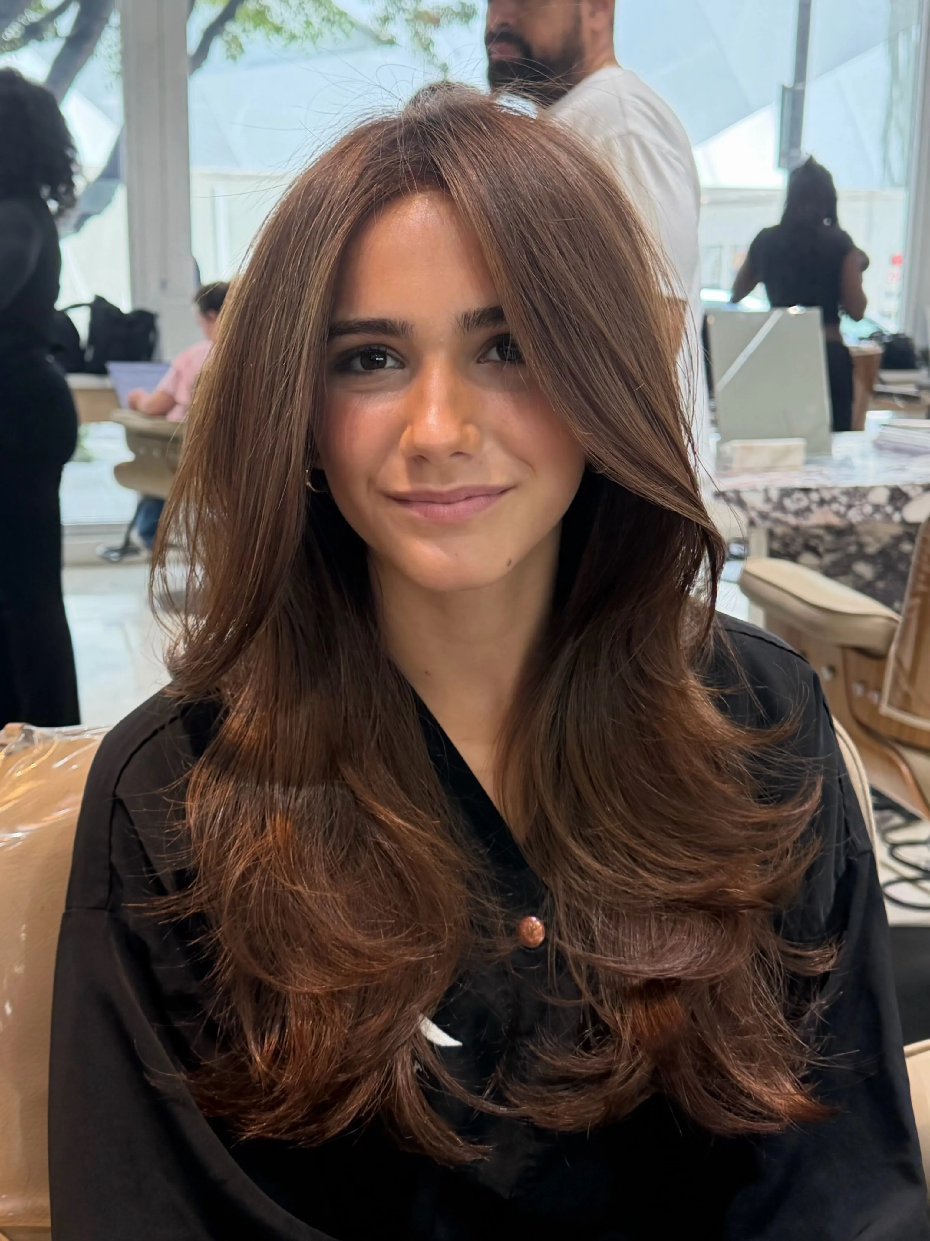 Long brunette butterfly layers with rounded curled ends