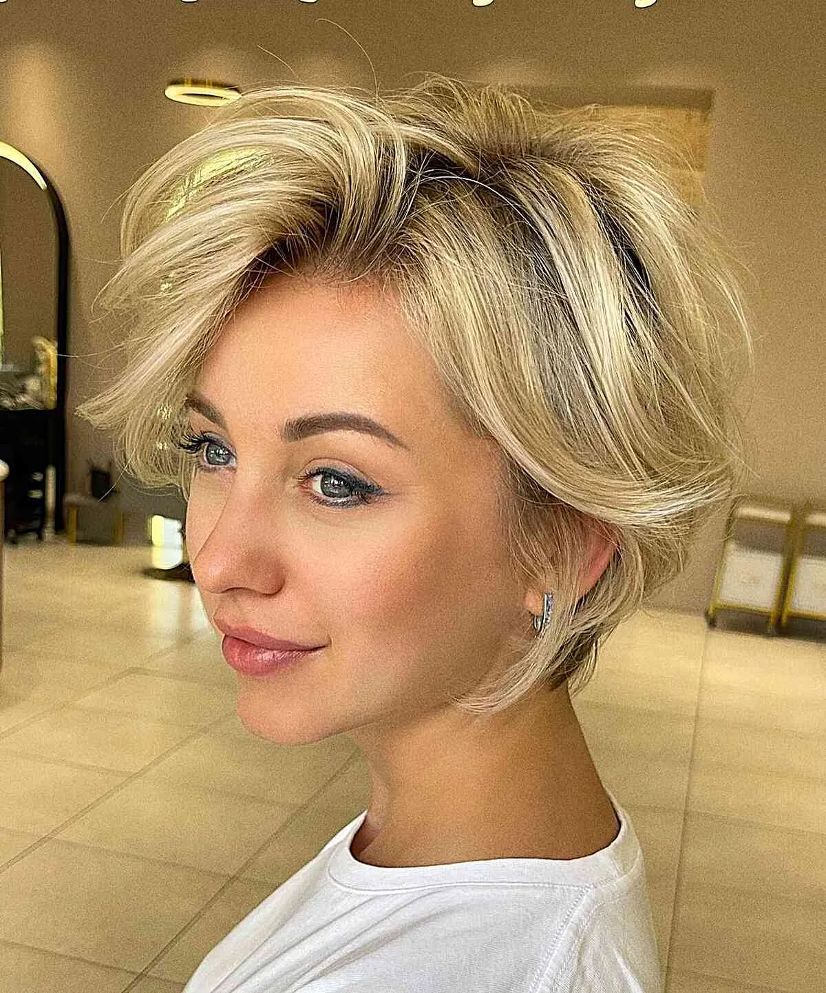 Layered blonde long pixie with crown volume