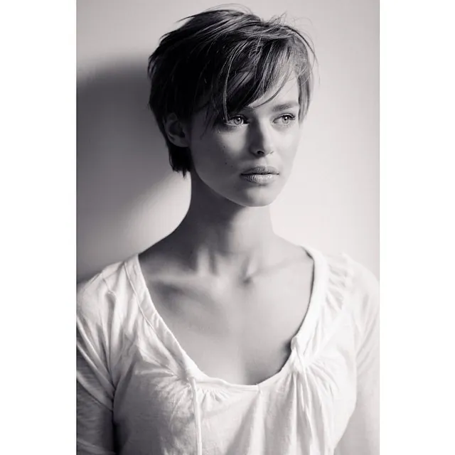 Sleek dark long pixie with side-swept fringe
