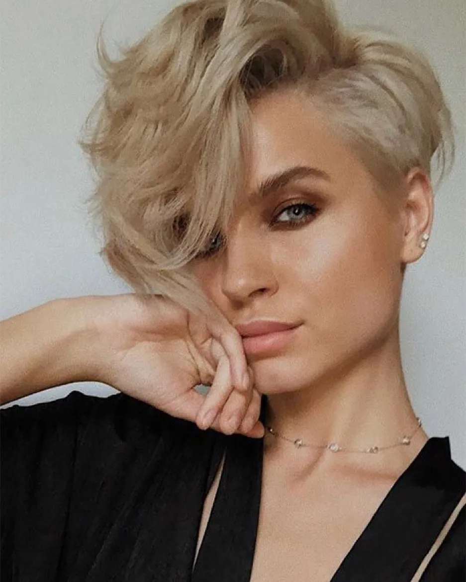 Voluminous blonde long pixie with sweeping fringe