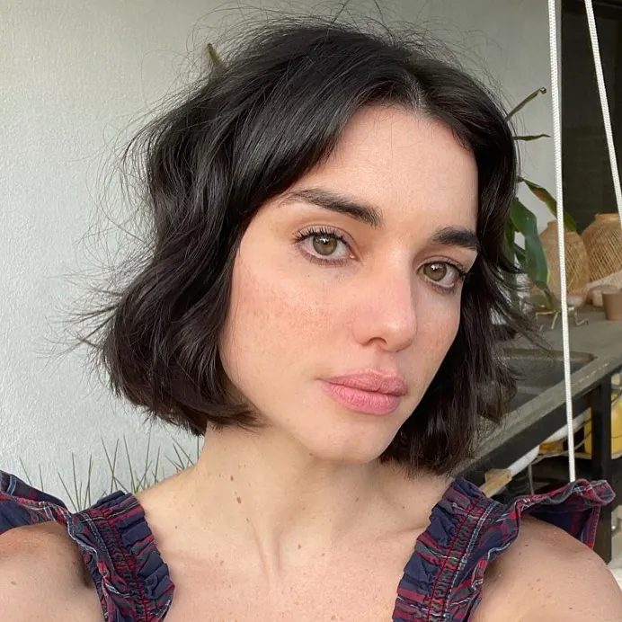 Wavy dark pixie bob with jaw-length sides