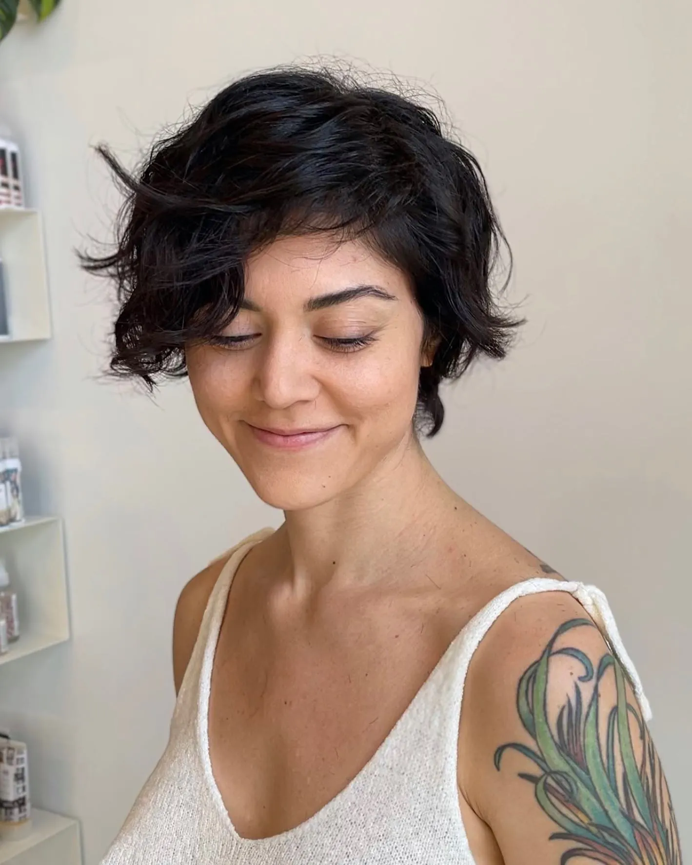 Tousled wavy long pixie with side-swept texture