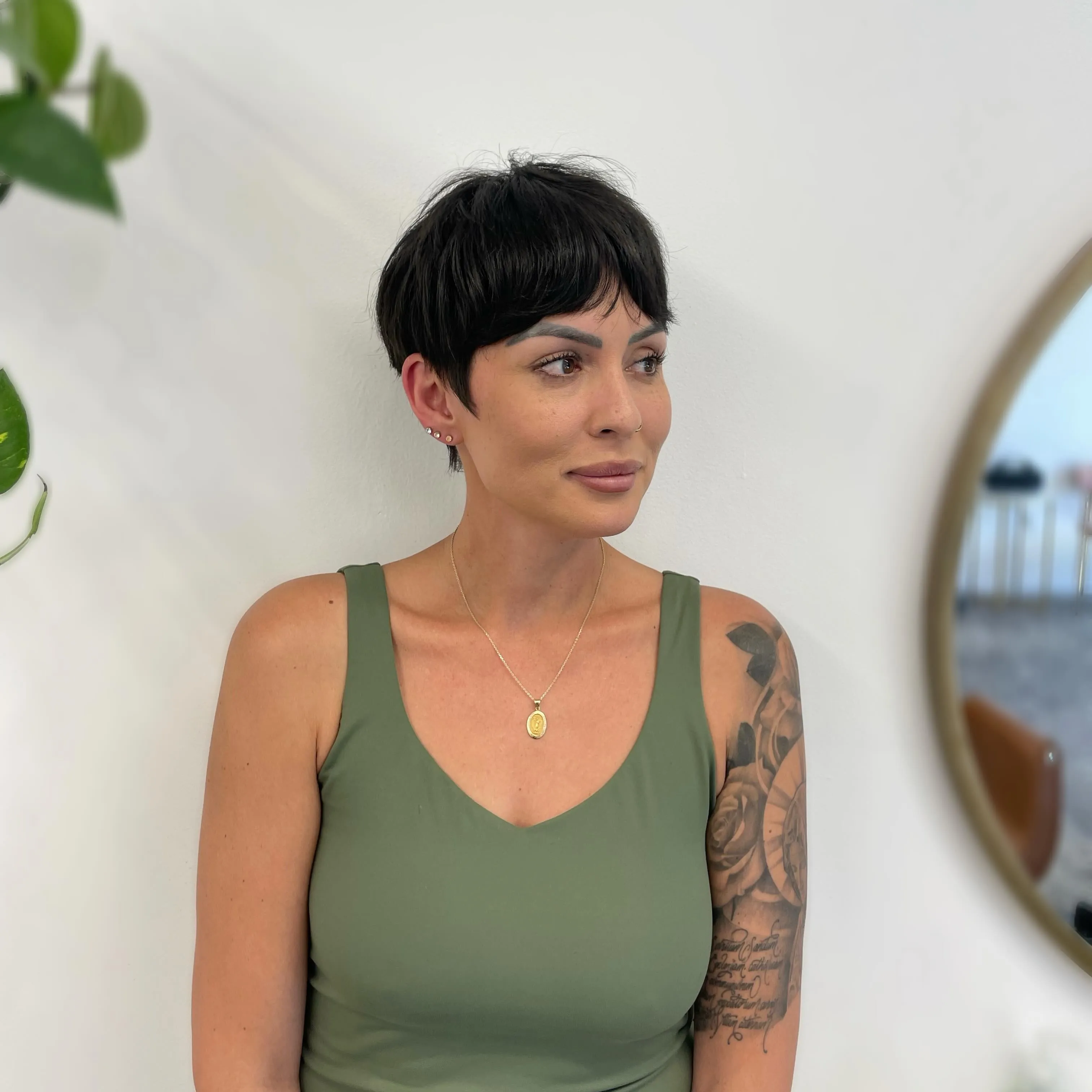 Short dark crop with smooth side-swept fringe