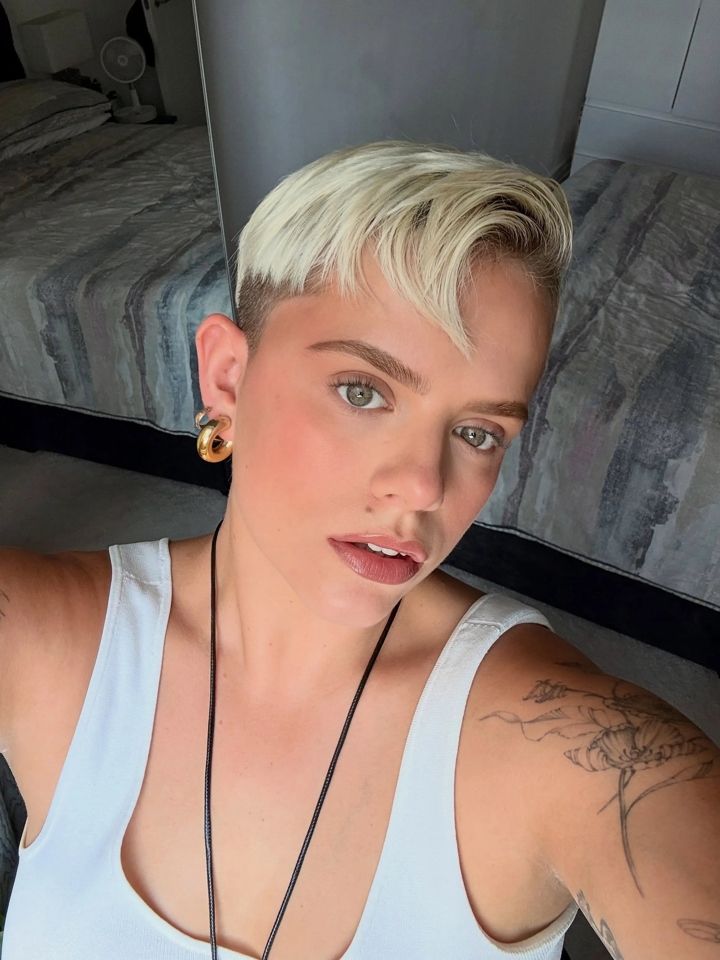 Platinum pixie with side part and closely cropped side