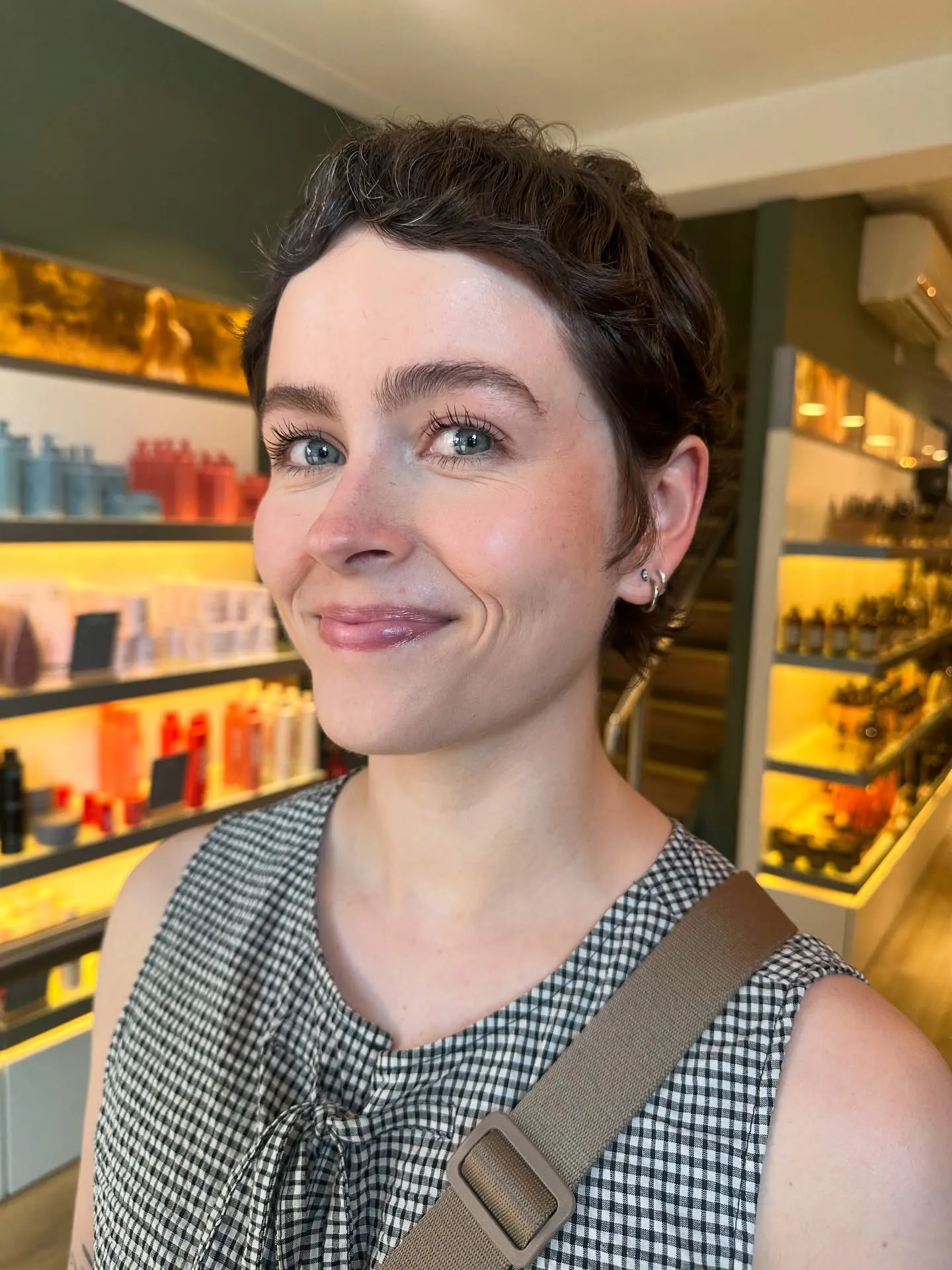 Short dark curly crop with rounded natural shape