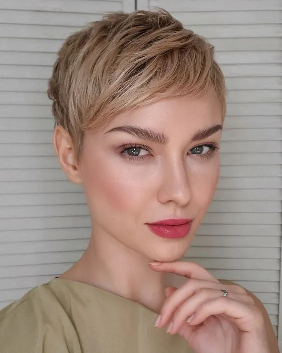 Feathered blonde pixie with soft side fringe