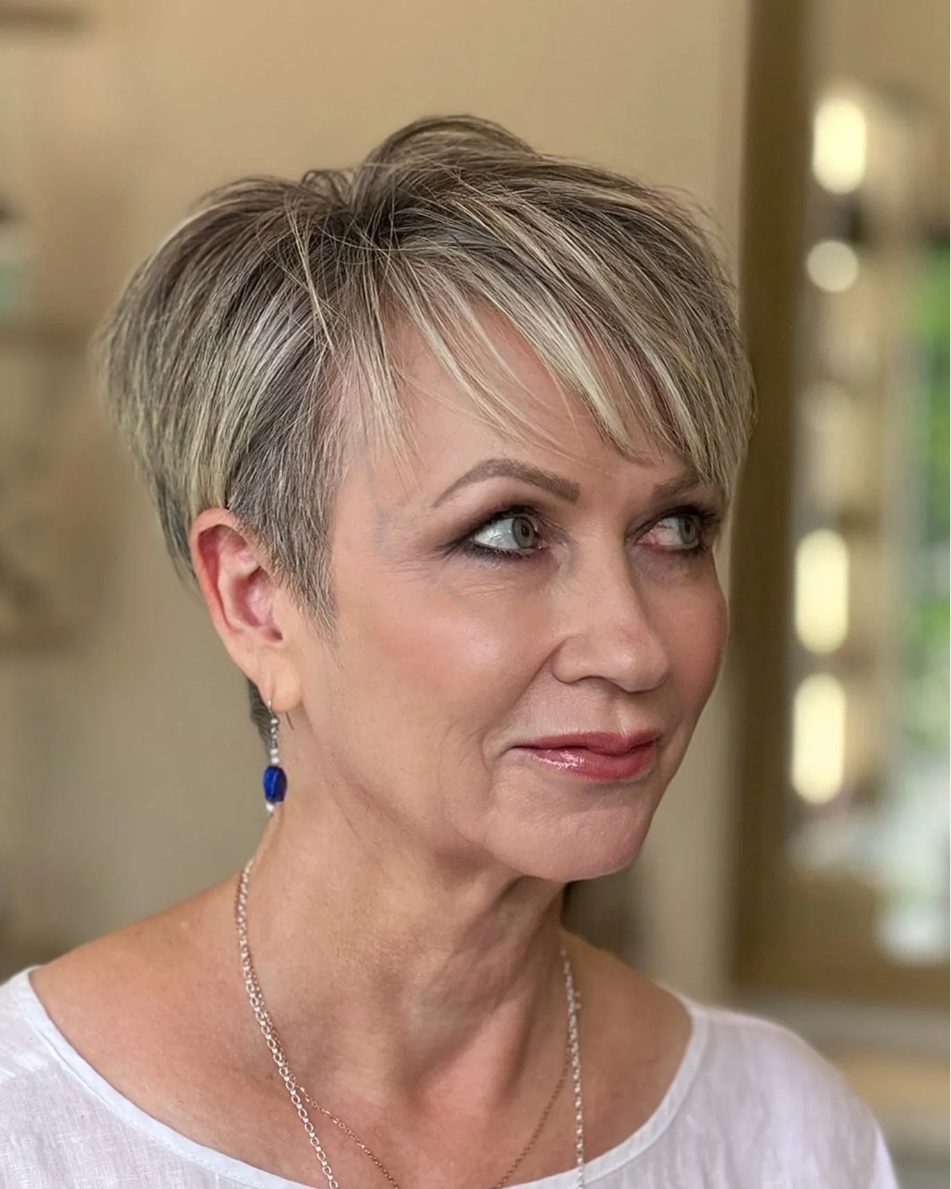 Silver pixie with long side-swept fringe and short sides